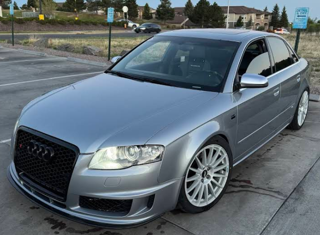 Silver Audi sedan with white powder-coated wheels