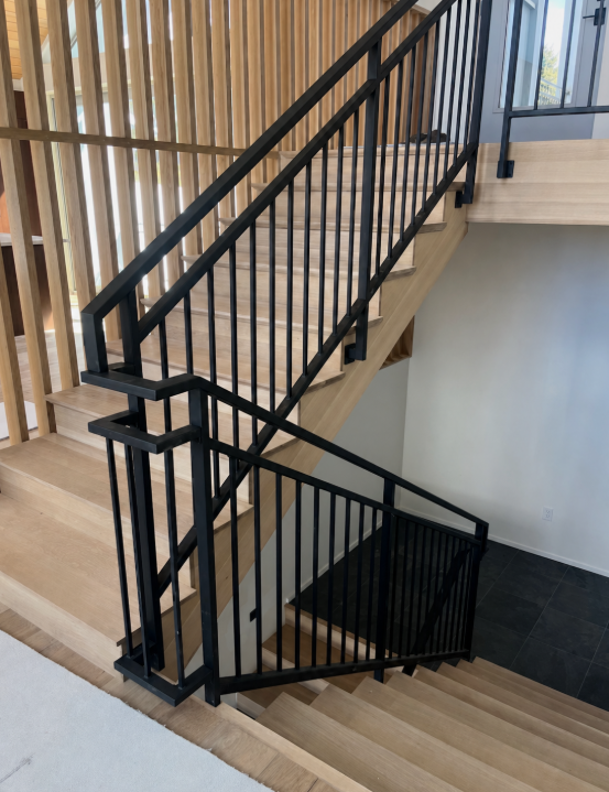 Interior staircase with black powder-coated railings